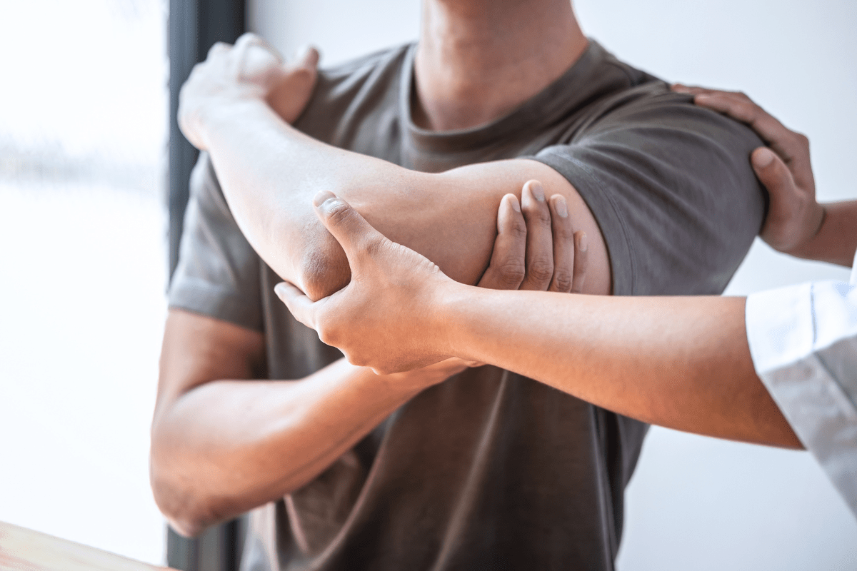 Image of a person receiving arm muscle treatment.