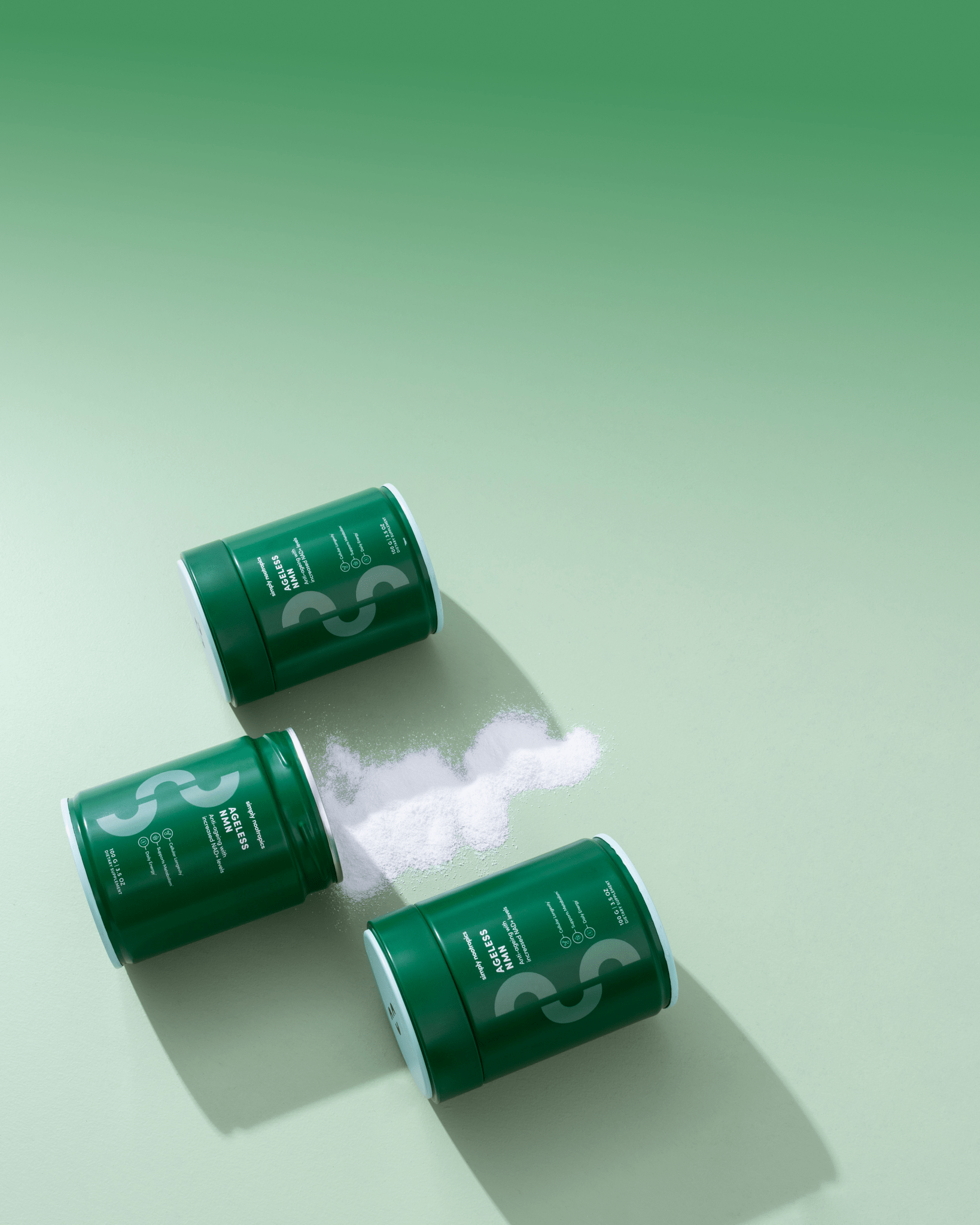 Three green canisters of NMN powder on a light green background with powder spilled from one canister.