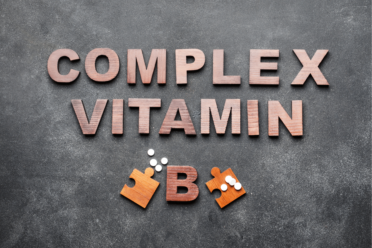 B-complex vitamin puzzle pieces on grey background.
