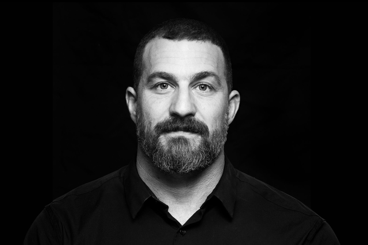 Black-and-white portrait of Andrew Huberman, neuroscientist and professor at Stanford University.