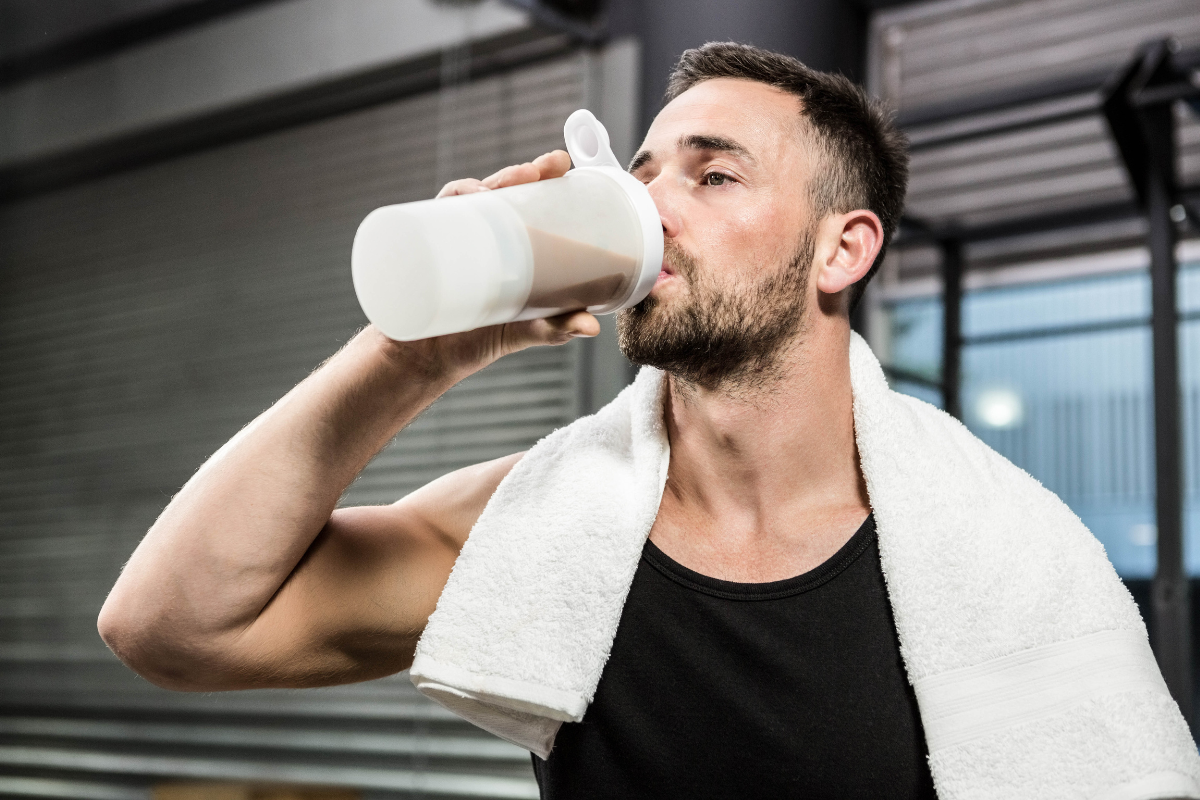 Man drinking a protein shake after a workout.