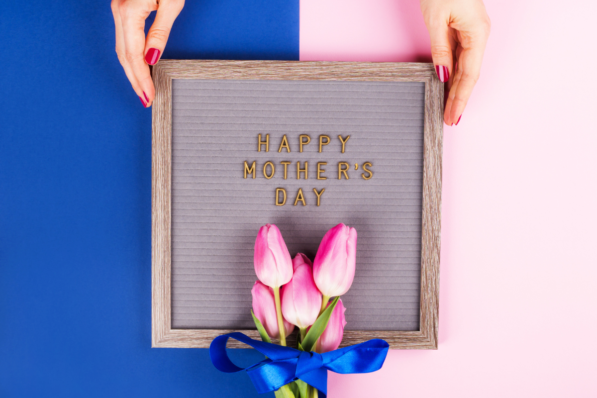 Framed “Happy Mother’s Day” message with pink tulips and blue ribbon.