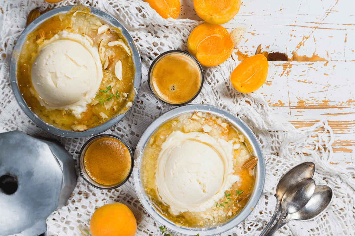 Two bowls of roasted apricot crumble.