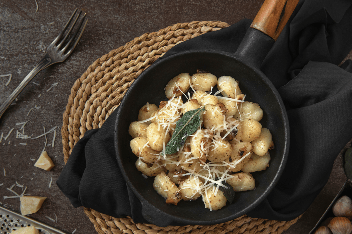 Potato gnocchi topped with crispy sage and grated cheese.