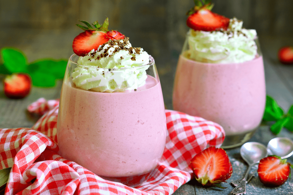 Glasses of strawberry mousse topped.